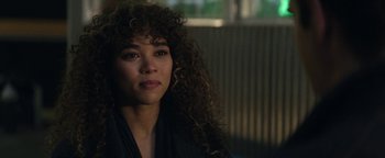 Movie still from “tick, tick... BOOM!” (2021), directed by Lin-Manuel Miranda – A person with curly brown hair; Close Up shot, Over the shoulder angle