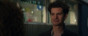 Movie still from “tick, tick... BOOM!” (2021), directed by Lin-Manuel Miranda – A person wearing a black jacket; Close Up shot, Over the shoulder angle