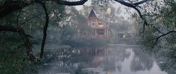 Movie still from “Solaris” (1972), directed by Andrei Tarkovsky – A house sitting next to a body of water; Extreme Wide shot, Low angle