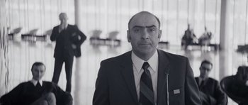 Movie still from “Solaris” (1972), directed by Andrei Tarkovsky – Black and white photograph of a man in a suit and tie; Close Up shot, Low angle