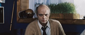 Movie still from “Solaris” (1972), directed by Andrei Tarkovsky – An older man wearing a sweater and a tie; Close Up shot, Low angle