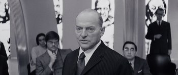 Movie still from “Solaris” (1972), directed by Andrei Tarkovsky – An older man wearing a suit and tie; Close Up shot, Low angle