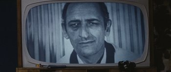 Movie still from “Solaris” (1972), directed by Andrei Tarkovsky – An old photo of an older man in front of a television; Extreme Close Up shot, Low angle