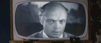 Movie still from “Solaris” (1972), directed by Andrei Tarkovsky – An old television screen showing a man's face; Extreme Close Up shot, Over the shoulder angle