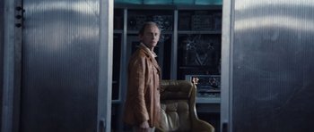 Movie still from “Solaris” (1972), directed by Andrei Tarkovsky – A man standing in front of a computer desk; Medium shot, Over the shoulder angle