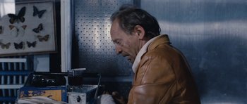 Movie still from “Solaris” (1972), directed by Andrei Tarkovsky – A man in a brown leather jacket looking down; Close Up shot, Low angle