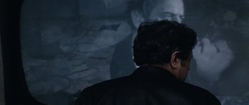 Movie still from “Solaris” (1972), directed by Andrei Tarkovsky – A man in a black jacket is looking at a wall; Close Up shot, Over the shoulder angle