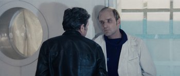 Movie still from “Solaris” (1972), directed by Andrei Tarkovsky – A man looking at another man in the mirror; Medium shot, Over the shoulder angle