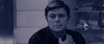 Movie still from “Solaris” (1972), directed by Andrei Tarkovsky – A black and white photo of a man with his chin resting on his hand; Close Up shot, Low angle