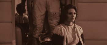 Movie still from “Solaris” (1972), directed by Andrei Tarkovsky – A woman sitting in front of a man with a motorcycle helmet; Medium shot, Over the shoulder angle