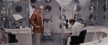 Movie still from “Solaris” (1972), directed by Andrei Tarkovsky – A man standing next to another man in a room; Medium shot, Over the shoulder angle