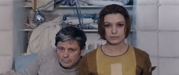 Movie still from “Solaris” (1972), directed by Andrei Tarkovsky – A man and a woman standing next to each other in a room; Medium shot, High angle