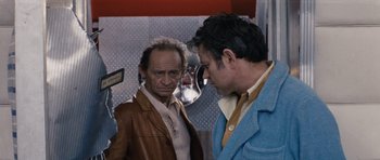 Movie still from “Solaris” (1972), directed by Andrei Tarkovsky – Two men standing next to each other in front of a mirror; Medium shot, Over the shoulder angle