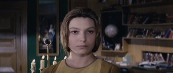 Movie still from “Solaris” (1972), directed by Andrei Tarkovsky – A young woman is looking into the camera; Close Up shot, Low angle