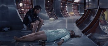 Movie still from “Solaris” (1972), directed by Andrei Tarkovsky – A man and a woman laying on the ground; Wide shot, High angle