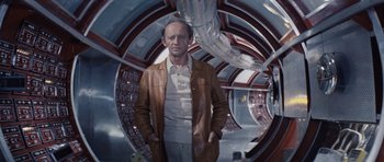 Movie still from “Solaris” (1972), directed by Andrei Tarkovsky – A man standing in an enclosed space with his hands in his pockets; Medium shot, Low angle