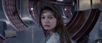 Movie still from “Solaris” (1972), directed by Andrei Tarkovsky – A woman with long brown hair wearing a white shirt; Close Up shot, High angle