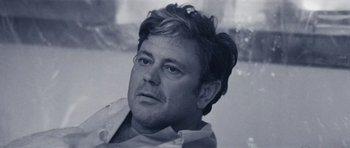 Movie still from “Solaris” (1972), directed by Andrei Tarkovsky – A black and white photo of a man with glasses; Close Up shot, Low angle