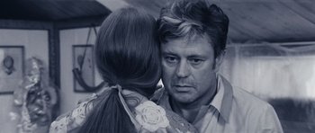 Movie still from “Solaris” (1972), directed by Andrei Tarkovsky – A man and a woman embracing each other in a black and white photo; Close Up shot, Over the shoulder angle