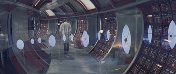 Movie still from “Solaris” (1972), directed by Andrei Tarkovsky – A man in a white coat is standing in front of a mirror; Wide shot, High angle