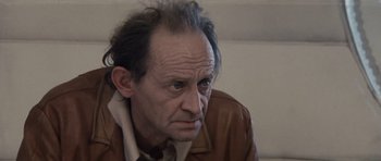 Movie still from “Solaris” (1972), directed by Andrei Tarkovsky – An older man with a gray hair and blue eyes; Close Up shot, Low angle