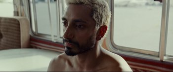 Movie still from “Sound of Metal” (2019), directed by Darius Marder – A person with a beard; Close Up shot, Over the shoulder angle