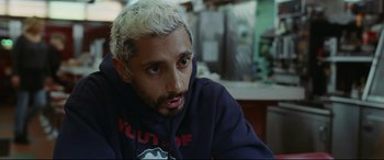 Movie still from “Sound of Metal” (2019), directed by Darius Marder – A person wearing a hoodie; Close Up shot, High angle