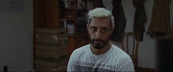 Movie still from “Sound of Metal” (2019), directed by Darius Marder – A person wearing a shirt; Close Up shot, High angle