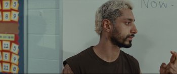 Movie still from “Sound of Metal” (2019), directed by Darius Marder – A person with tattoos on their face; Close Up shot, High angle
