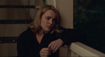 Movie still from “Spotlight” (2015), directed by Tom McCarthy – A woman leaning against a wall with her hand on her shoulder; Close Up shot, Over the shoulder angle