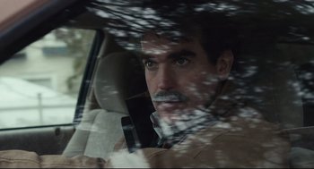 Movie still from “Spotlight” (2015), directed by Tom McCarthy – A man in a car looking out of the window; Close Up shot, Over the shoulder angle