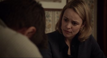 Movie still from “Spotlight” (2015), directed by Tom McCarthy – A woman sitting in front of a man in front of a mirror; Close Up shot, Over the shoulder angle