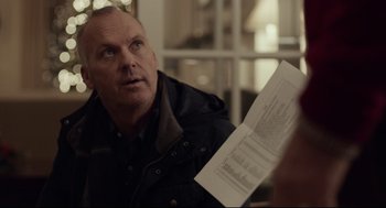 Movie still from “Spotlight” (2015), directed by Tom McCarthy – A man holding papers looking at the camera; Close Up shot, Over the shoulder angle