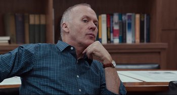 Movie still from “Spotlight” (2015), directed by Tom McCarthy – A person sitting at a table; Close Up shot, Low angle