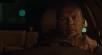 Movie still from “Spotlight” (2015), directed by Tom McCarthy – A man sitting in the driver's seat of a car at night; Close Up shot, Over the shoulder angle