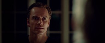 Movie still from “Steve Jobs” (2015), directed by Danny Boyle – A person looking at the camera; Close Up shot, Over the shoulder angle