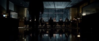 Movie still from “Steve Jobs” (2015), directed by Danny Boyle – A group of people sitting at a table in front of a window; Wide shot, Low angle