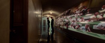 Movie still from “Steve Jobs” (2015), directed by Danny Boyle – A man and a woman are standing in a tunnel; Extreme Wide shot, High angle