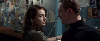 Movie still from “Steve Jobs” (2015), directed by Danny Boyle – A man and a woman looking at one another; Close Up shot, Over the shoulder angle