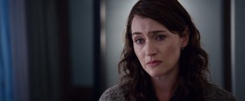 Movie still from “Steve Jobs” (2015), directed by Danny Boyle – A person with long brown hair; Close Up shot, Over the shoulder angle