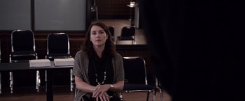 Movie still from “Steve Jobs” (2015), directed by Danny Boyle – A woman sitting on a chair in front of a man; Medium shot, Over the shoulder angle