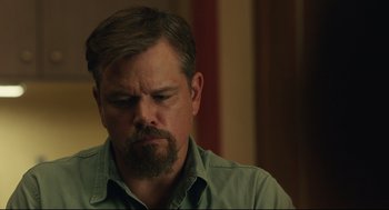 Movie still from “Stillwater” (2021), directed by Tom McCarthy – A person with a beard; Close Up shot, Over the shoulder angle