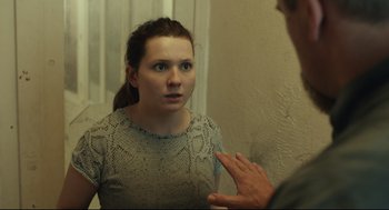 Movie still from “Stillwater” (2021), directed by Tom McCarthy – A young woman talking to a man in a bathroom; Close Up shot, Over the shoulder angle