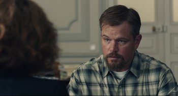 Movie still from “Stillwater” (2021), directed by Tom McCarthy – A person wearing a plaid shirt; Close Up shot, Over the shoulder angle