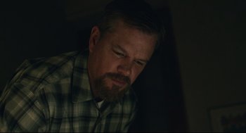 Movie still from “Stillwater” (2021), directed by Tom McCarthy – A person wearing a plaid shirt; Close Up shot, Low angle