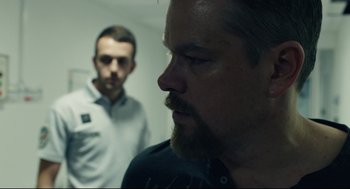 Movie still from “Stillwater” (2021), directed by Tom McCarthy – A man with a beard is looking at a man with a beard; Close Up shot, Over the shoulder angle