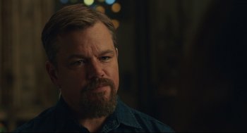 Movie still from “Stillwater” (2021), directed by Tom McCarthy – A person with a beard; Close Up shot, Over the shoulder angle