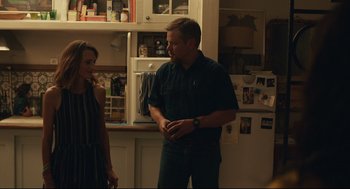 Movie still from “Stillwater” (2021), directed by Tom McCarthy – A man and a woman standing in a kitchen; Medium shot, Over the shoulder angle