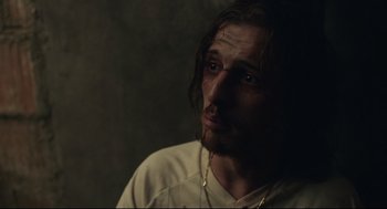 Movie still from “Stillwater” (2021), directed by Tom McCarthy – A person with long dark hair; Close Up shot, Over the shoulder angle