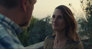 Movie still from “Stillwater” (2021), directed by Tom McCarthy – A man and a woman looking at one another; Close Up shot, Over the shoulder angle